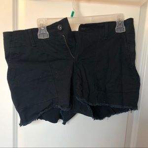 Navy shorts with distressed bottom edge